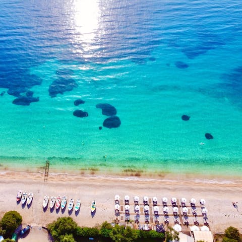 Flip-flop down to the smooth pebble shores of Barbati Beach, just 600 metres away