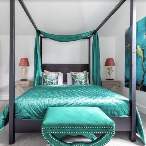 Fall asleep in the luxurious four-poster bed
