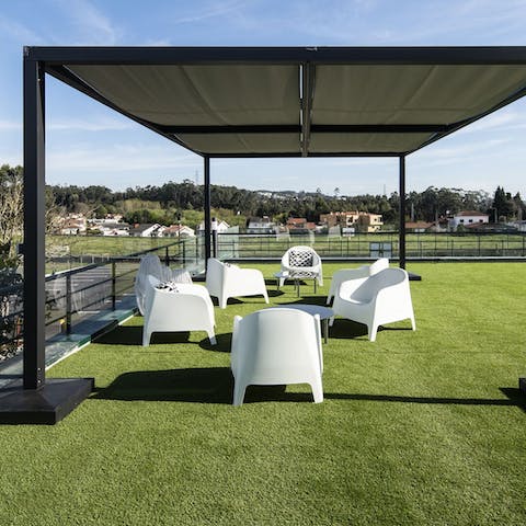 Take your sundowner on the astroturf rooftop terrace