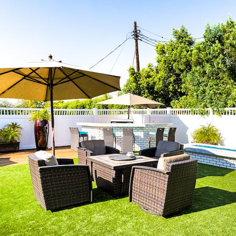 Entertain friends in the garden – there's a fire pit, barbecue and plenty of seating