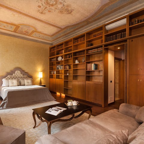 Admire the fabulous ceiling frescoes in the bedrooms