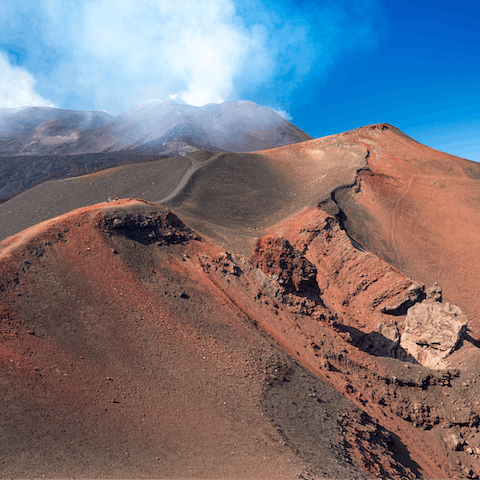 Explore the volcanic landscape of Mount Etna, a thirty-three-minute drive away