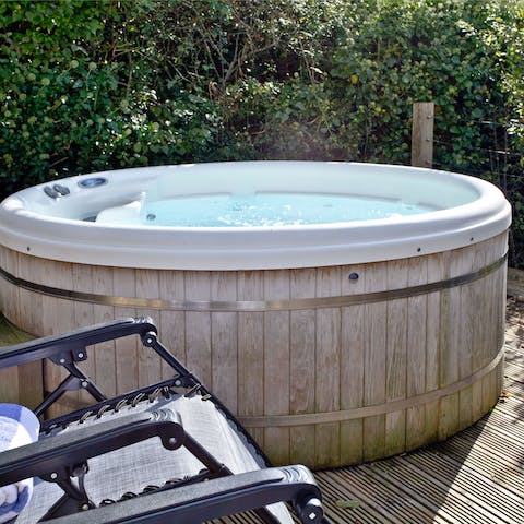 Warm up on chilly evenings in the bubbling hot tub 
