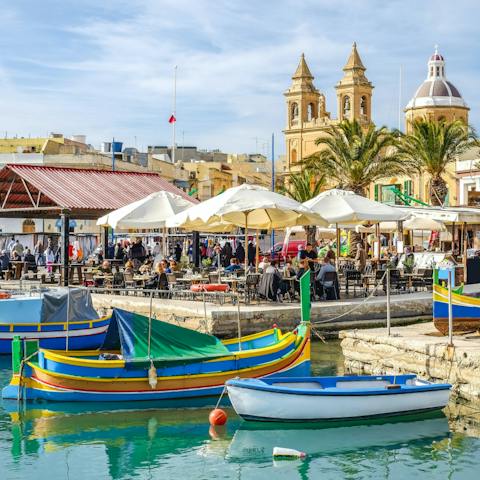 Drive 11km to the picturesque fishing village of Marsaxlokk, where beautiful boats bob in the harbour