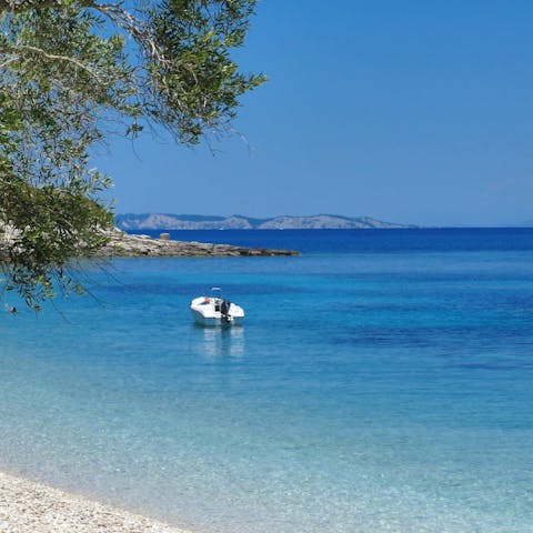 Dip your toes in the crystal clear water of Monodendri – just a short walk away