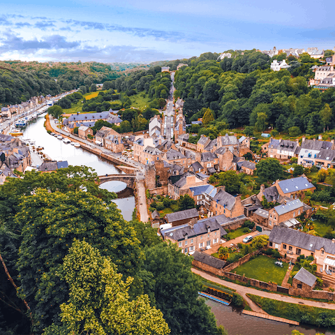 Stroll along the pretty streets of Dinan, with the castle looking over the city