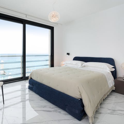 Wake up to a gentle sea breeze in your soothing bedroom