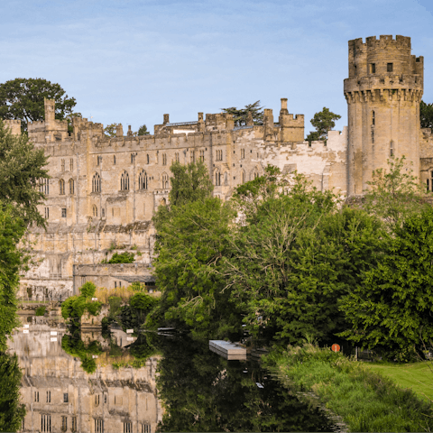 Walk the medieval grounds of Warwick Castle, only a ten-minute drive away