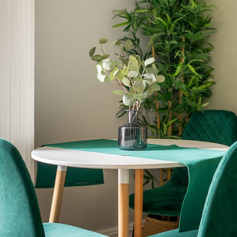 Gather at the stylish dining table for home-cooked meals