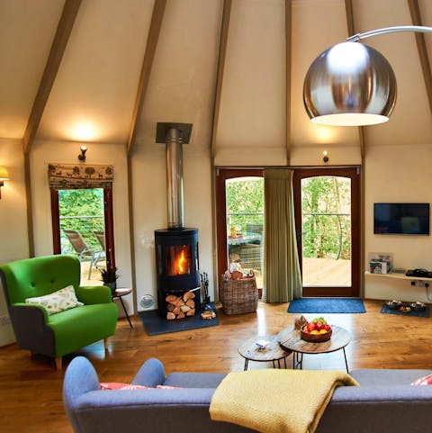 Cosy up by the wood burning stove at chillier times of year