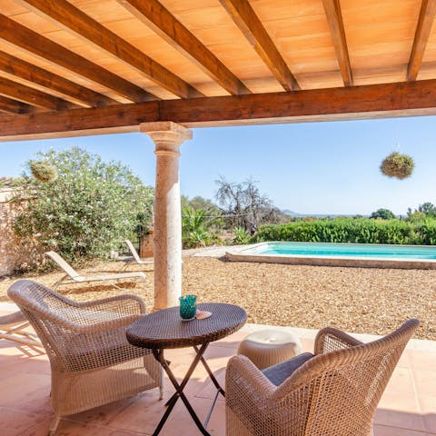 Retreat to the shade of the terrace when you need a break from the rays