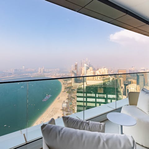 Relax and unwind on your private balcony with stunning ocean views before you 