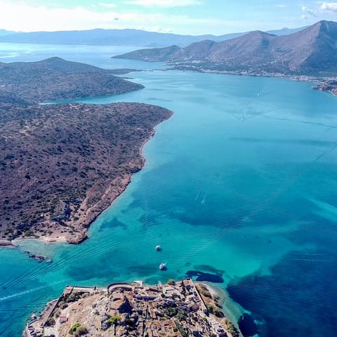 Take a boat trip around the island of Vardiola St. Nicholas, it's just off Limenarchio Agiou Nikolaou 