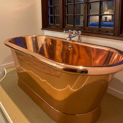 Make time for a long soak in the stunning freestanding bathtub