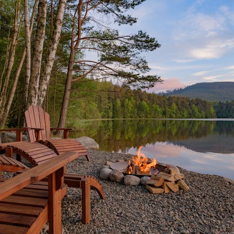 Sit around the fire pit on the shingle beach each evening