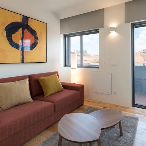 Relax in the stylish living room with a glass of Portuguese wine after a day of sightseeing
