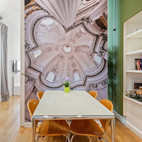 Sit down for a light lunch while admiring the statement dome wall
