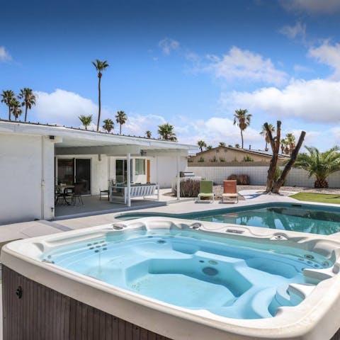 Grab a glass of bubbly and sink into the poolside Jacuzzi