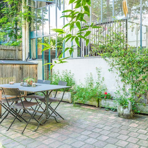 Dine alfresco on some local French cuisine in the tranquil private garden space 