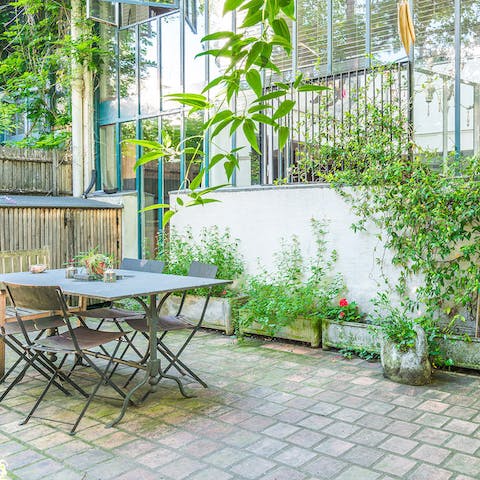 Dine alfresco on some local French cuisine in the tranquil private garden space
