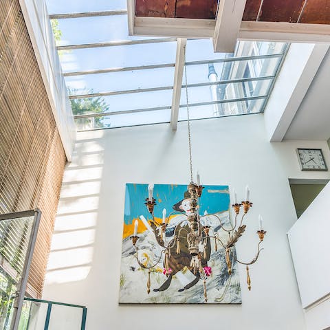 Admire the unique double-height ceilings and skylights that invite light to flow through the home – a rare find when staying in Paris