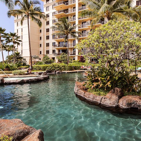Spend days in the sparkling outdoor pool and soak up the sun poolside