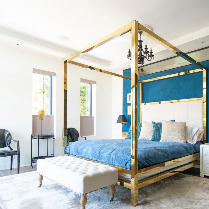 Sleep like royalty on the gold four-poster bed