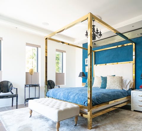 Sleep like royalty on the gold four-poster bed