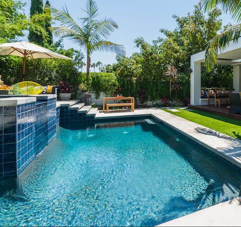 Float about gracefully in the sparkling pool before sitting in the hot tub