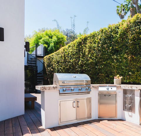 Cook up a mighty feast on the large outdoor kitchen set-up