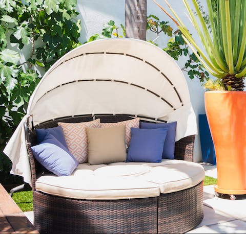 Take a break from the LA sunshine in the rattan daybed