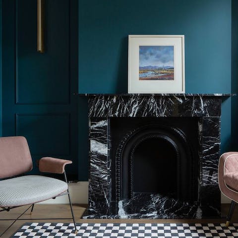 Find a cosy spot to unwind while taking in the striking colour palette with original features