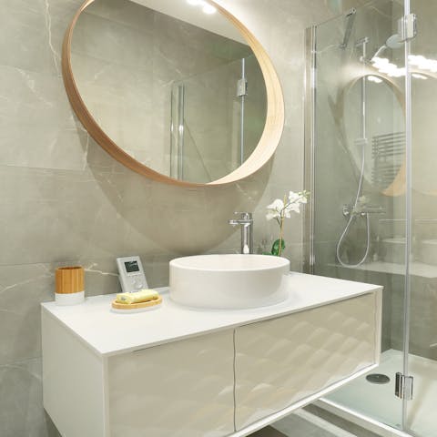 Pamper yourself in the sleek and tranquil bathroom space 