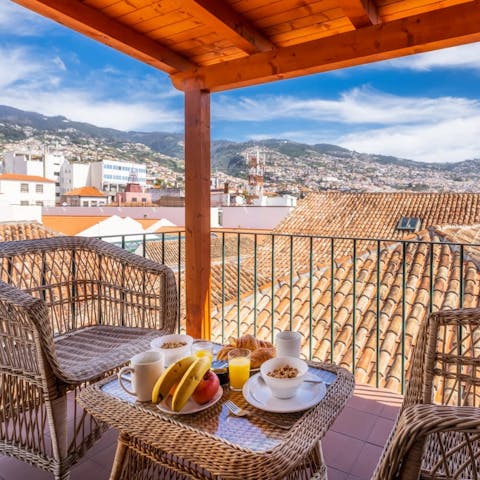 Start your mornings with breakfast on the private veranda, overlooking the Madeira rooftops