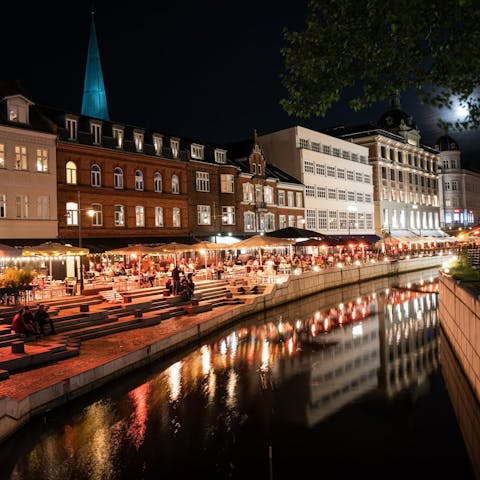 Make the forty-minute drive to Aarhus and dine by the riverside