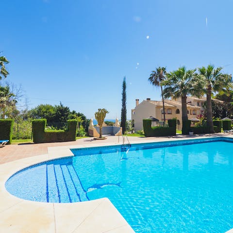 Cool off from the hot Malaga sun in the calm waters of the communal pool