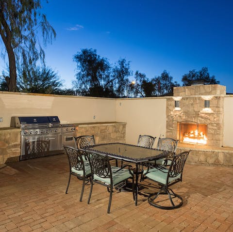 Cook up a storm in the outdoor kitchen, complete with a fireplace