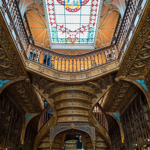 Visit Livraria Lello, one of the world's most beautiful bookstores, under a fifteen-minute walk away