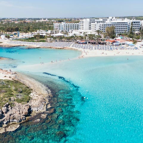 Take the ten-minute drive to Ayia Napa and sink your feet into the sand at Nissi Beach
