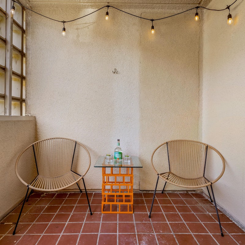 Mix yourself a drink and enjoy beneath the twinkling lights while the sun sets over the desert