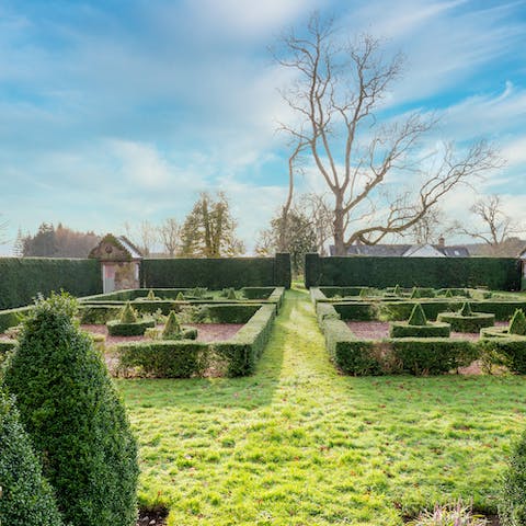 Explore the manicured formal gardens