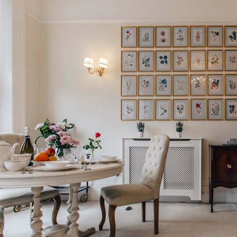 Enjoy a meal around the dining table and admire the vintage artwork