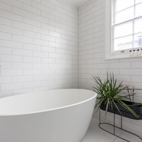 Treat yourself to a soak in the freestanding tub after a day of exploring