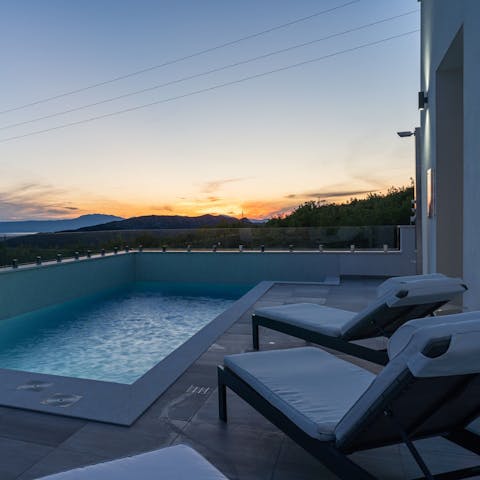 Sip a sundowner as you enjoy the sunset from a sunlounger by the pool