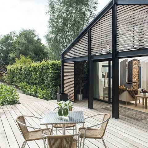 Enjoy the tranquillity of the local area out on the home's terrace