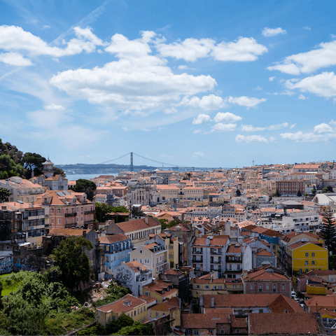 Look out over the city's rooftops towards the River Tagus from the splendid terrace at Miradouro da Graça – just 300 metres up the hill 