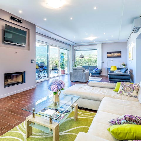 Socialise in the inviting living areas, one of which has a modern fireplace