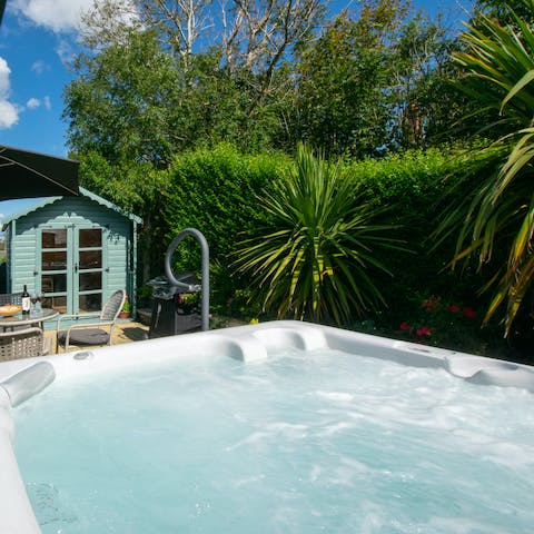 Relax in the hot tub with a bottle of Champagne after a day at the beach