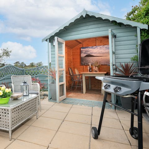 Enjoy a cosy nightcap in the beach hut in the garden