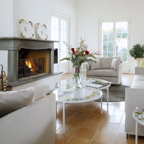 Light the fire and spend cosy afternoons reading in the elegant living room